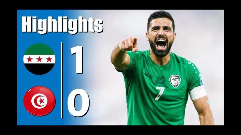 Cầu thủ Palestine với áo đỏ đang dốc hết sức mình để cản phá cầu thủ Tunisia với áo trắng. Cầu thủ Palestine với áo đỏ đang dốc hết sức mình để cản phá cầu thủ Tunisia với áo trắng.